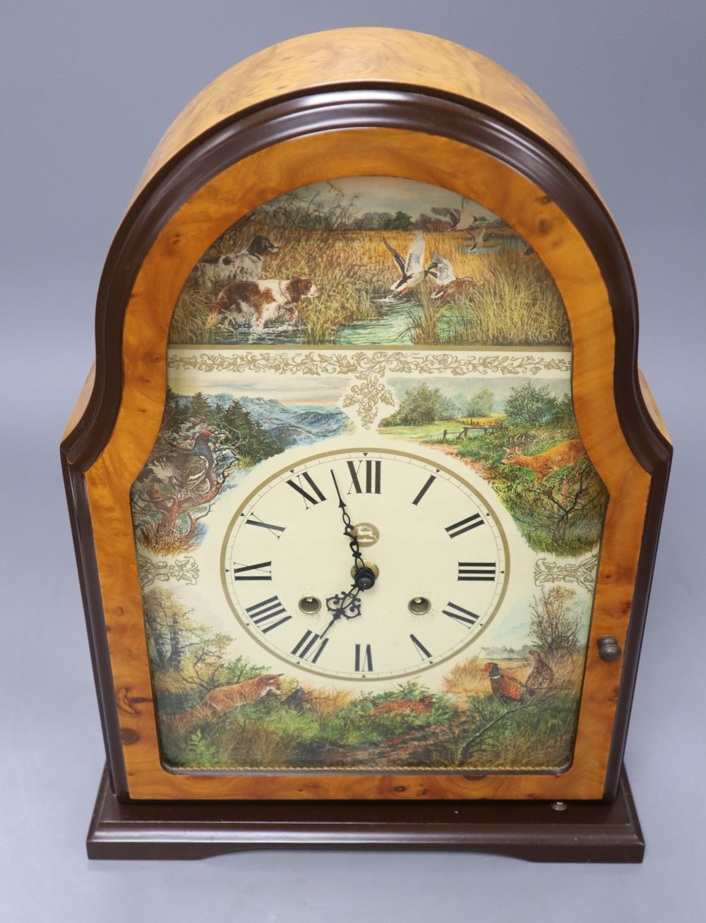 A Victorian style maple mantel clock